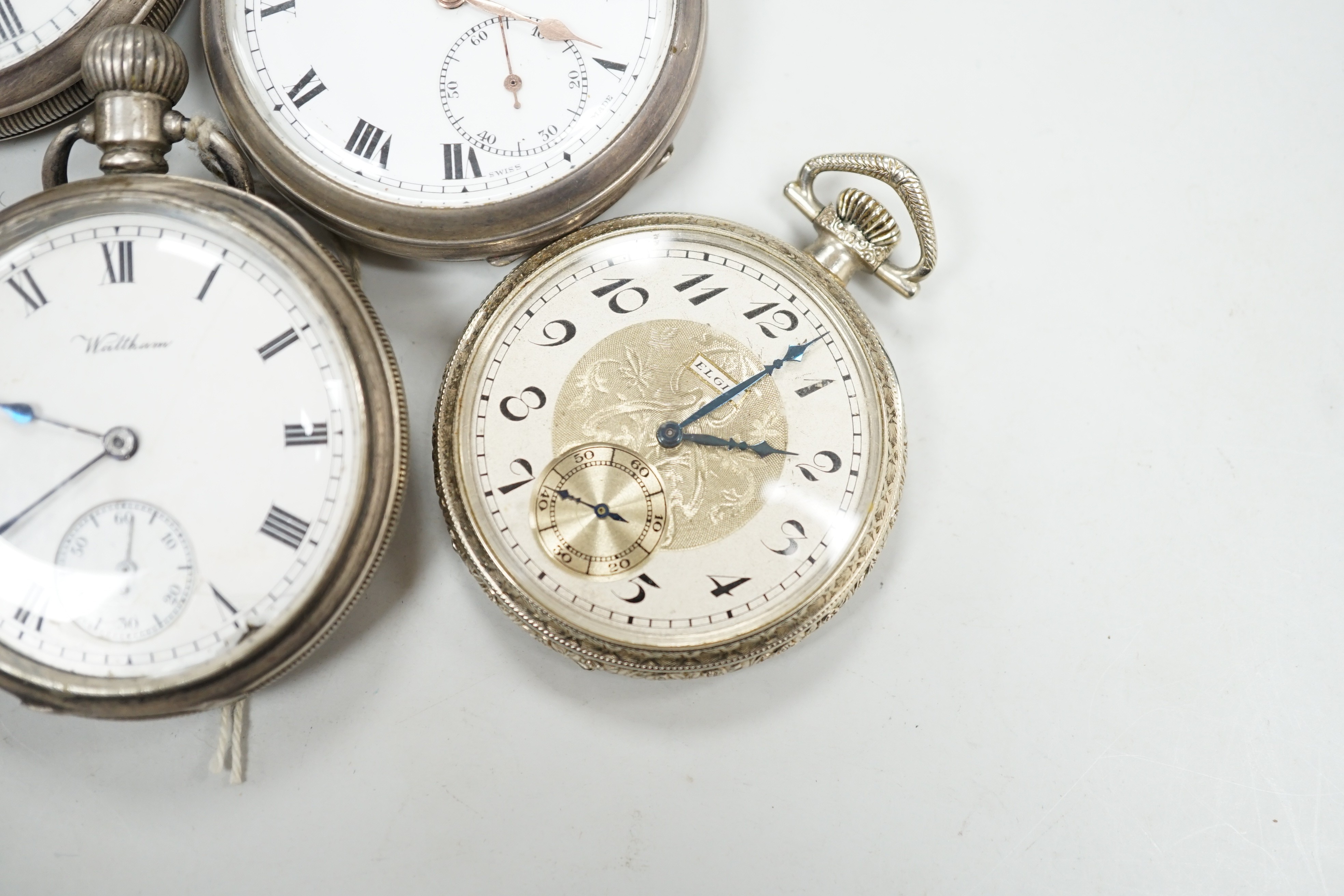 Four assorted silver open faced pocket watches including two Waltham and a J.W. Benson and two other base metal pocket watches.